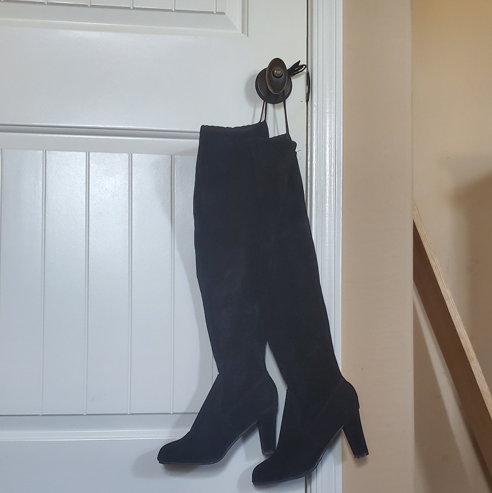 Knee high black high heeled boots